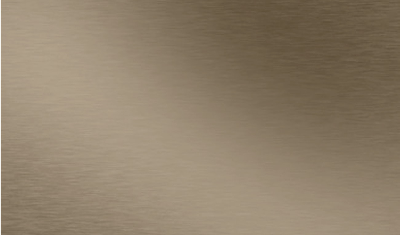 Brushed metallic surface in warm tones.