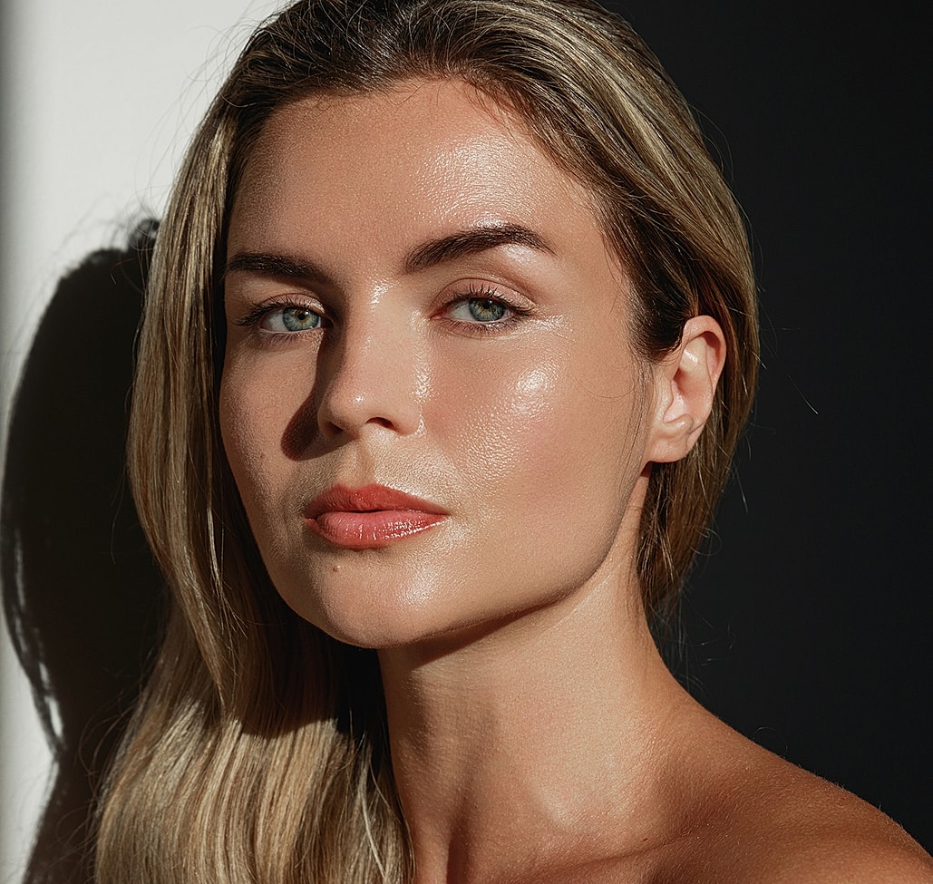 Natural portrait of a woman with glowing skin.