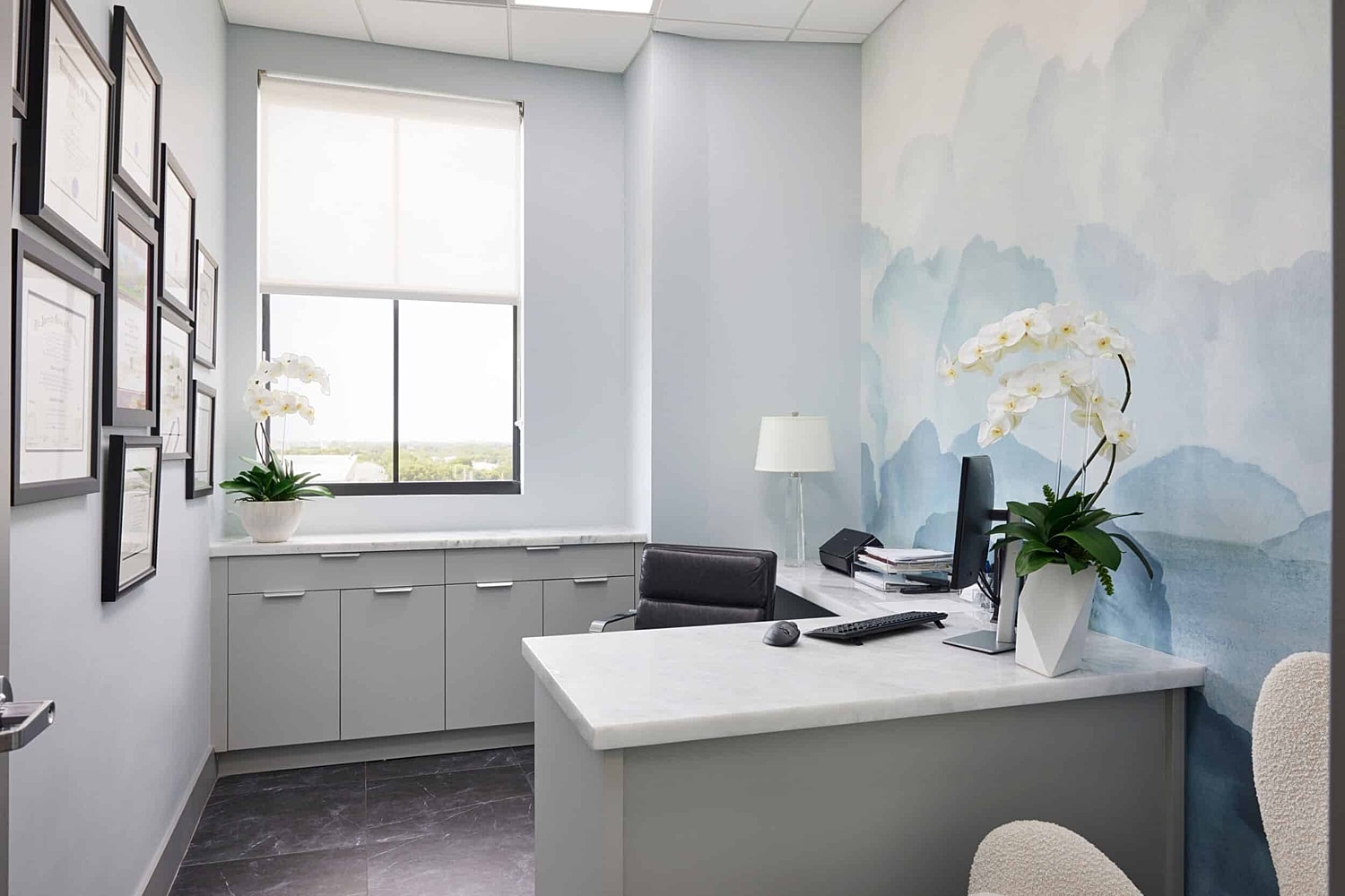 Stylish modern office with floral decor.