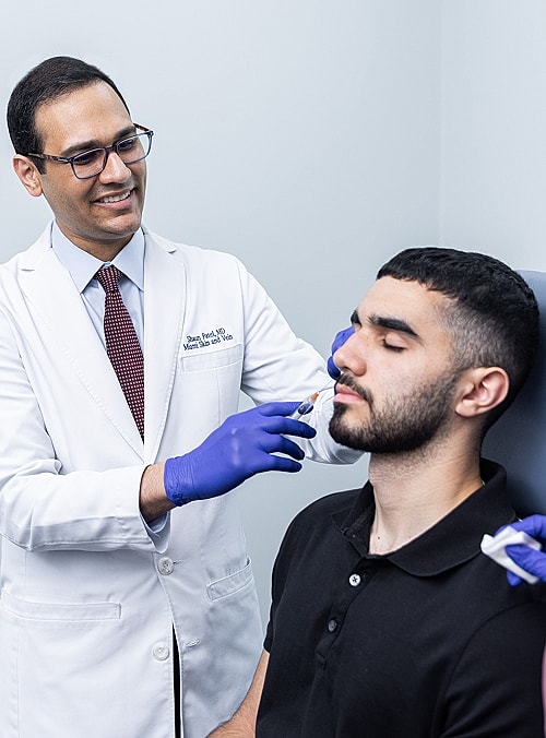 Doctor administering treatment to a patient.
