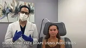 Doctor discussing facial injectables with patient.