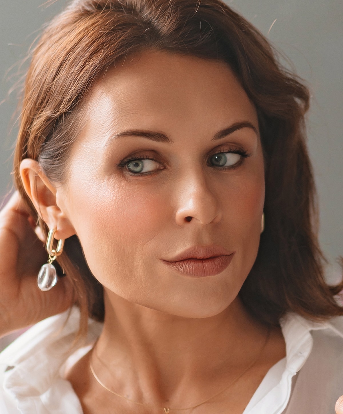 Doctor administering treatment to woman in clinic.