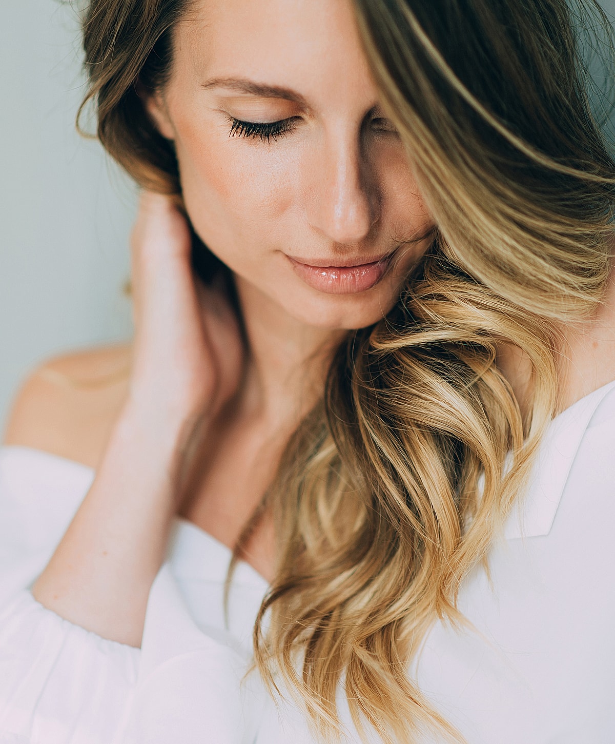 Close-up of a woman with long, wavy hair.