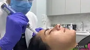 Medical professional performing skincare treatment on patient.