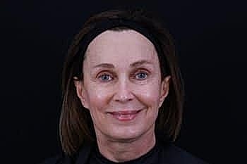Smiling woman with medium-length brown hair