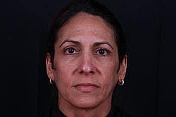Close-up portrait of a woman with dark hair.