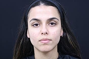 Portrait of a woman with long hair.