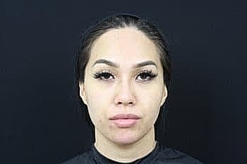 Portrait of a woman with long eyelashes.