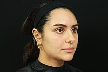 Profile of a woman with minimal makeup.