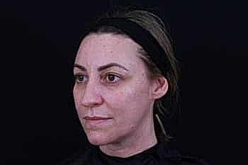 Profile view of a woman with headband.