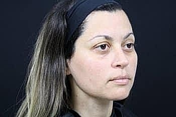 Profile of a woman with straight hair.