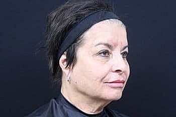 Profile of a woman with short hair.