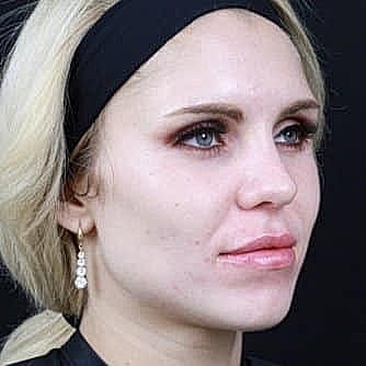 Portrait of a woman with light makeup.