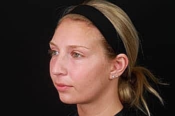 Woman with blonde hair and headband profile view.