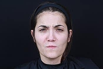 Serious woman with a neutral expression.