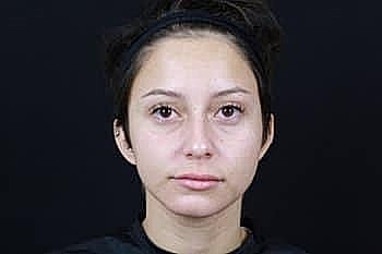 Close-up portrait of a woman with short hair.