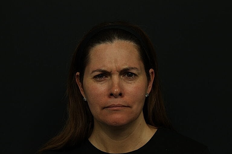 Woman with a serious facial expression.