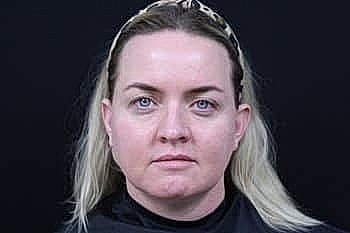 Close-up portrait of a woman with blonde hair.