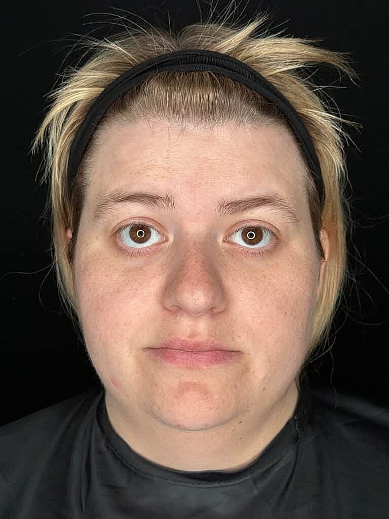 Person with light hair and neutral expression.