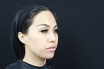 Side profile of a woman with makeup.