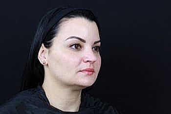 Woman with makeup waiting for application.