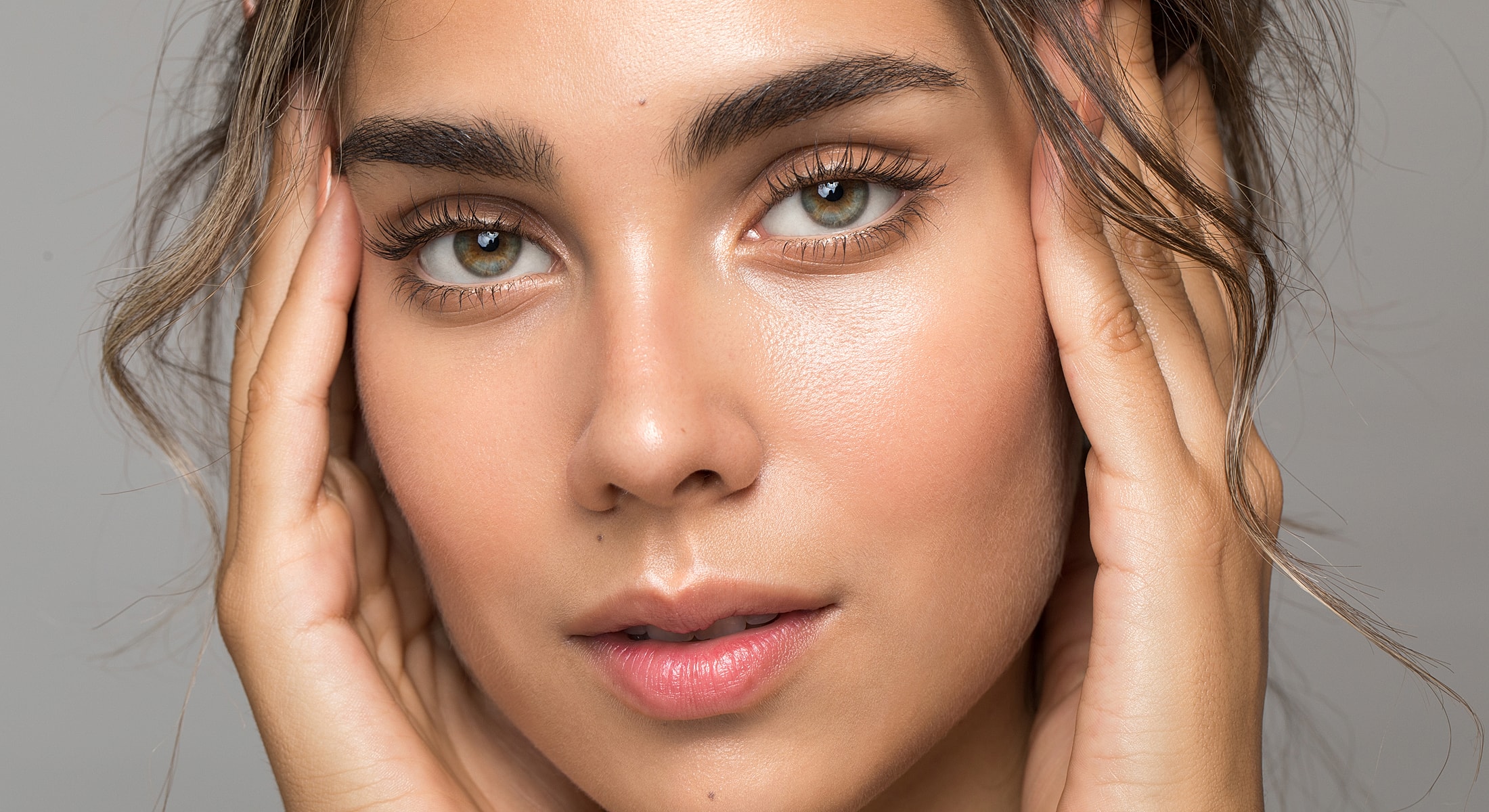 Close-up of a woman with expressive eyes.