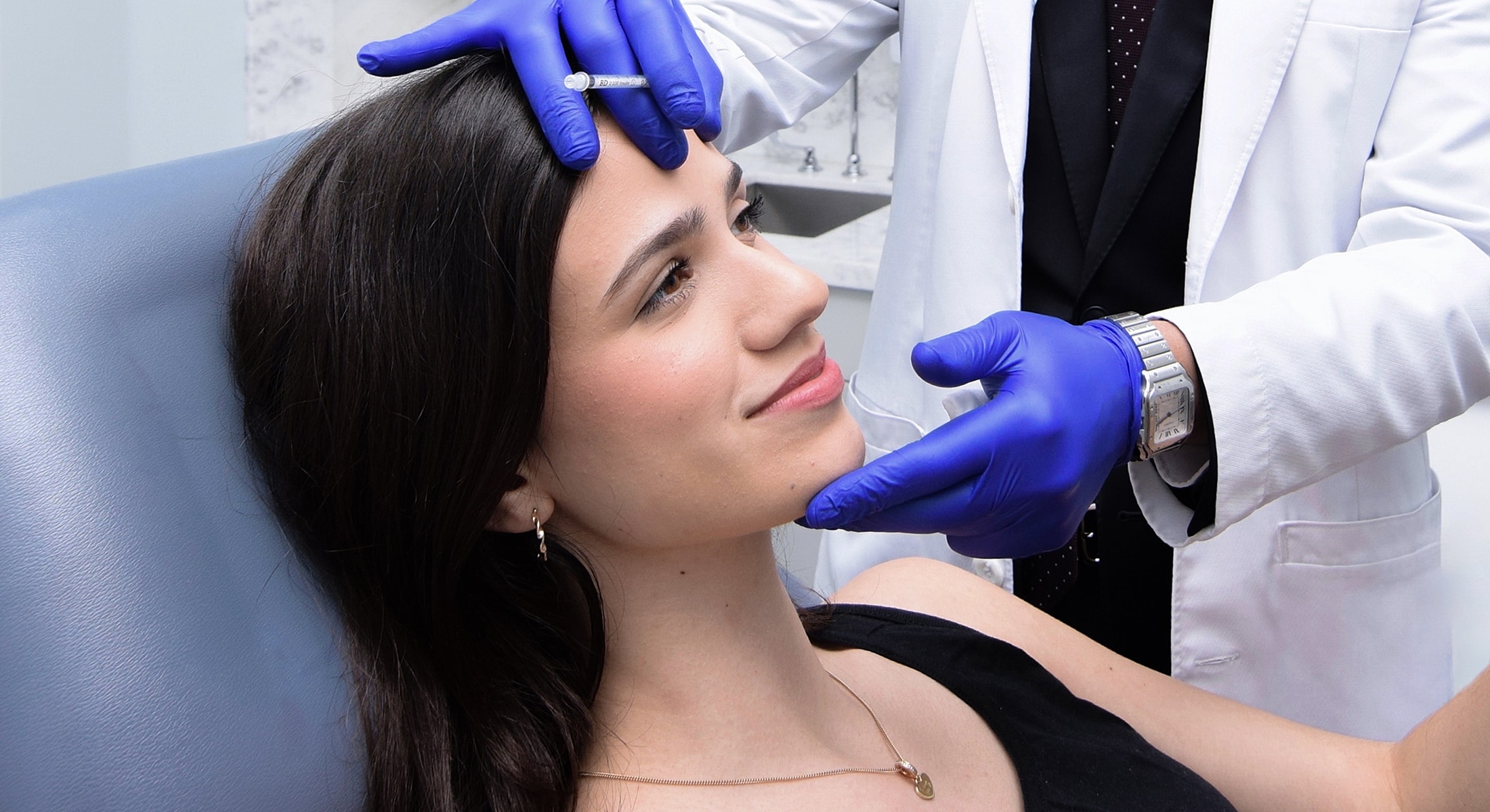 Patient receiving aesthetic treatment in clinic.