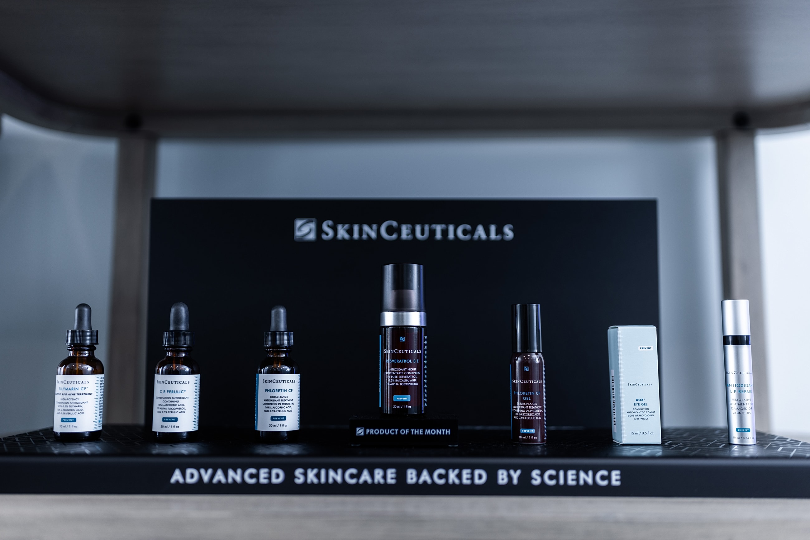 SkinCeuticals skincare products displayed on shelf.