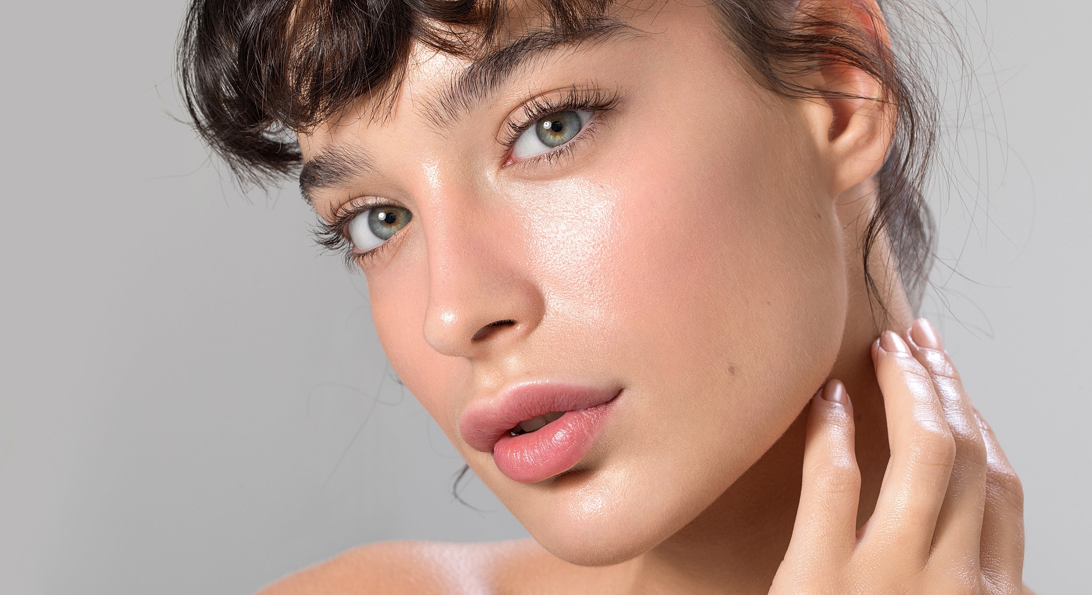 Close-up of a woman's glowing face.