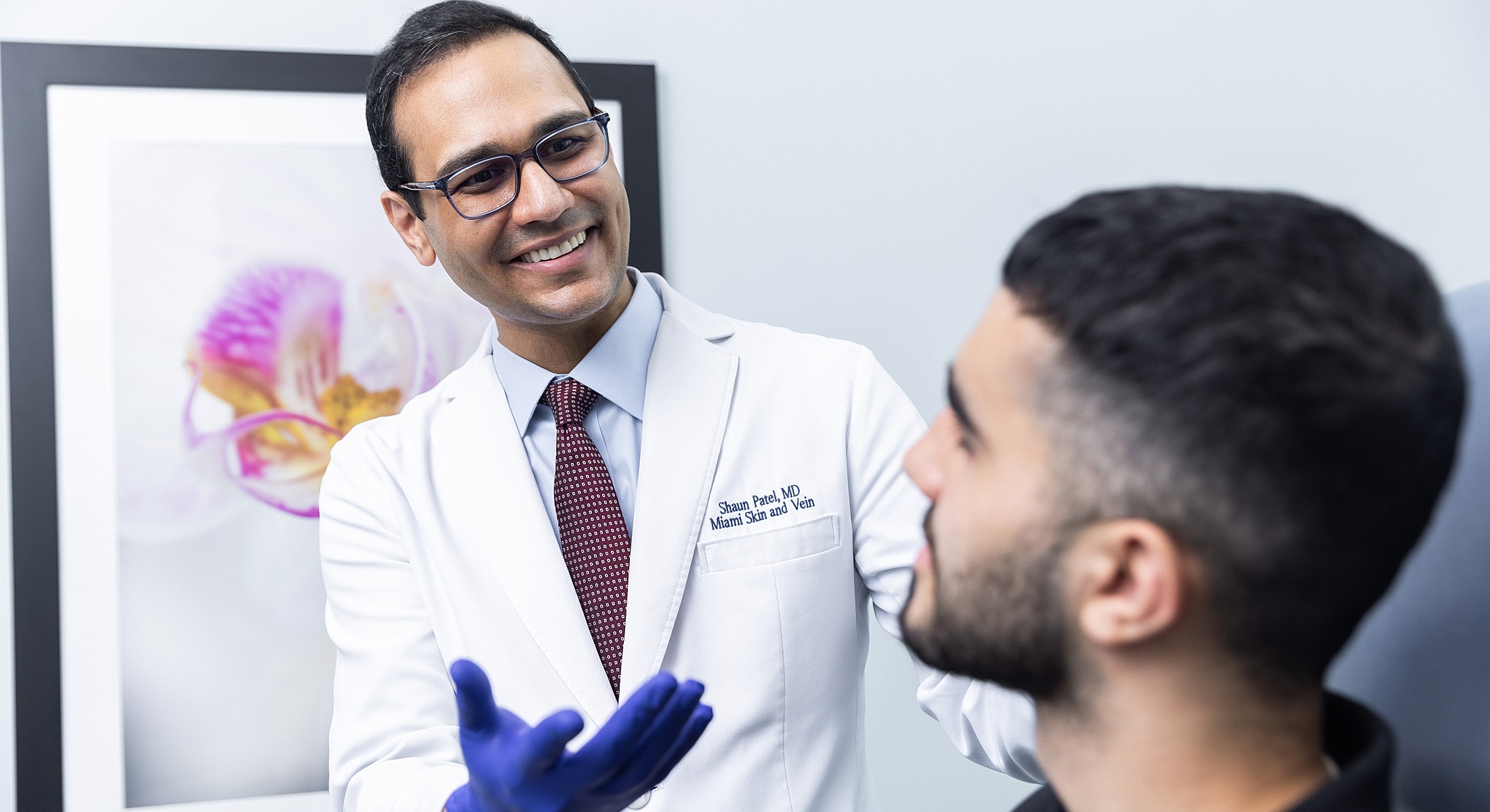 Doctor consulting with patient in medical office.